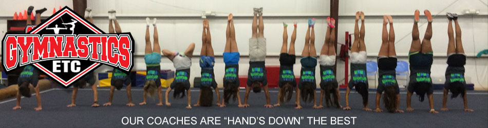 Gymnasts in a hands-down line. Gymnastics ETC: our coaches are hands down the best.
